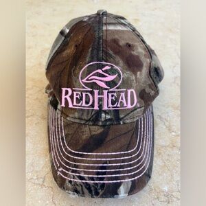 red head camo and pink baseball cap
